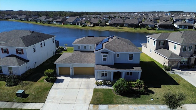 bird's eye view with a water view and a residential view