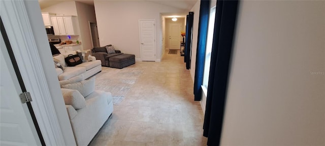 living area featuring lofted ceiling