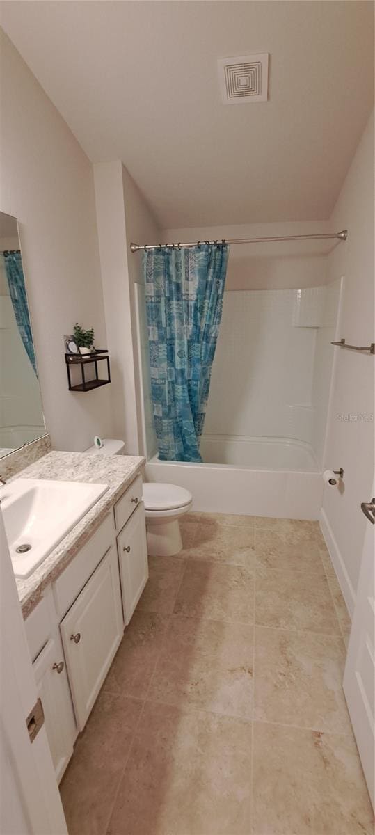 bathroom featuring visible vents, vanity, toilet, and shower / tub combo