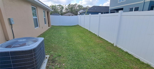 view of yard featuring cooling unit and a fenced backyard