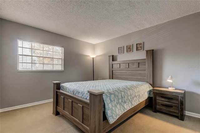 bedroom featuring baseboards, a textured ceiling, and light colored carpet