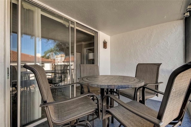 balcony with outdoor dining area