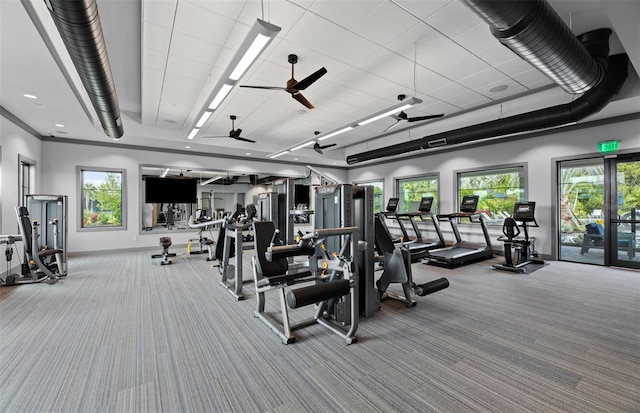 exercise room featuring a ceiling fan, french doors, carpet flooring, and baseboards