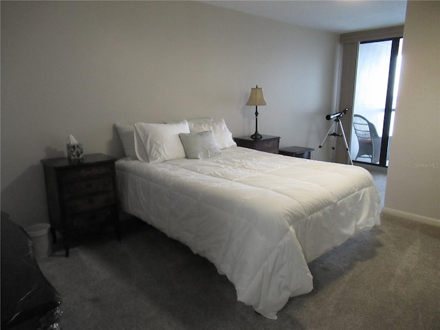 bedroom with carpet and baseboards