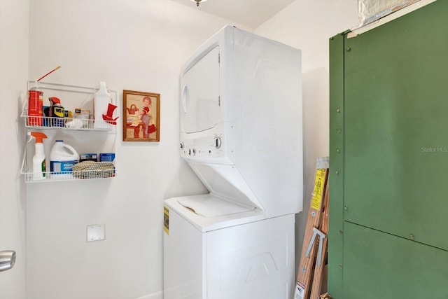 laundry room with laundry area and stacked washing maching and dryer