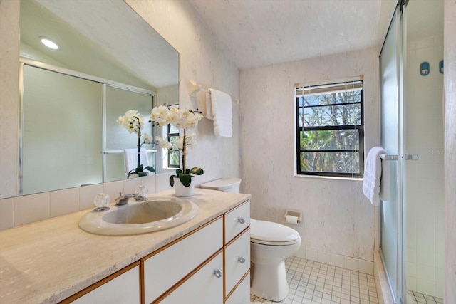 full bathroom with tile patterned floors, toilet, a shower stall, baseboards, and vanity