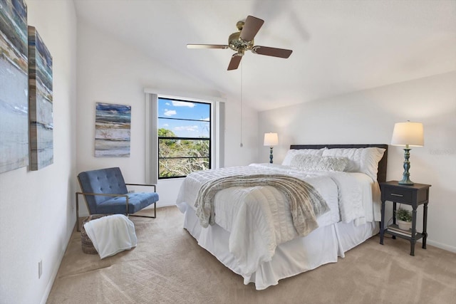 bedroom featuring lofted ceiling, a ceiling fan, baseboards, and carpet floors