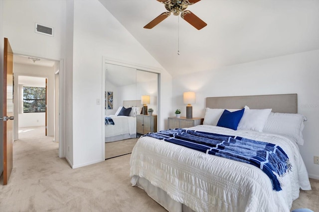 bedroom with visible vents, carpet floors, high vaulted ceiling, ceiling fan, and a closet