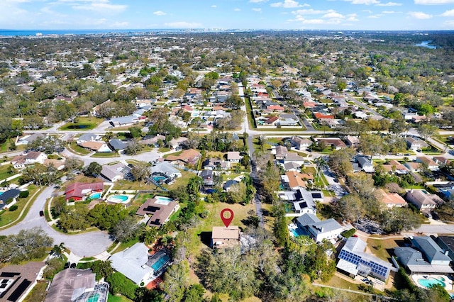 birds eye view of property with a residential view