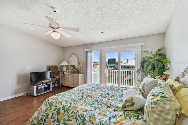 bedroom featuring baseboards, ceiling fan, wood finished floors, access to exterior, and a textured ceiling