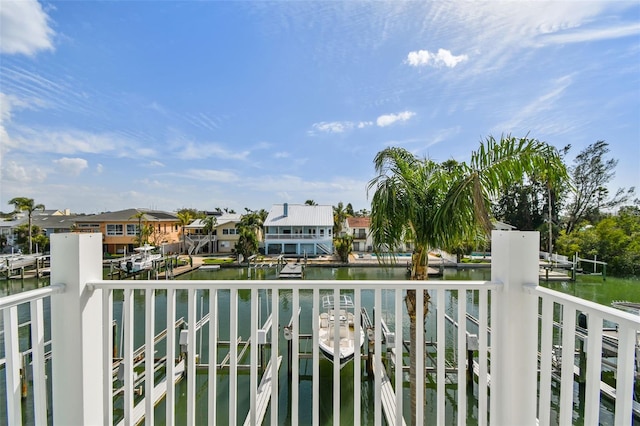 balcony with a water view and a residential view