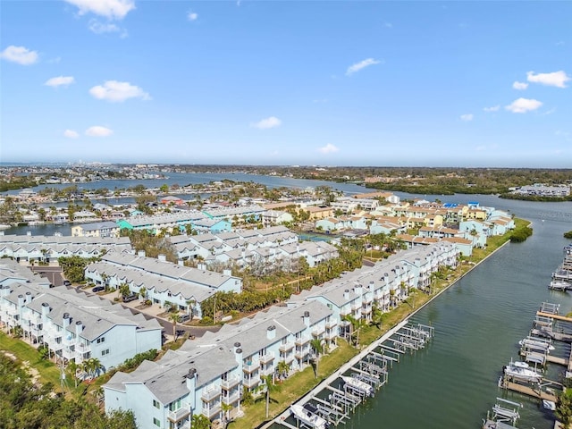 birds eye view of property with a water view and a residential view