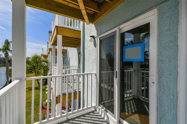 balcony featuring a water view