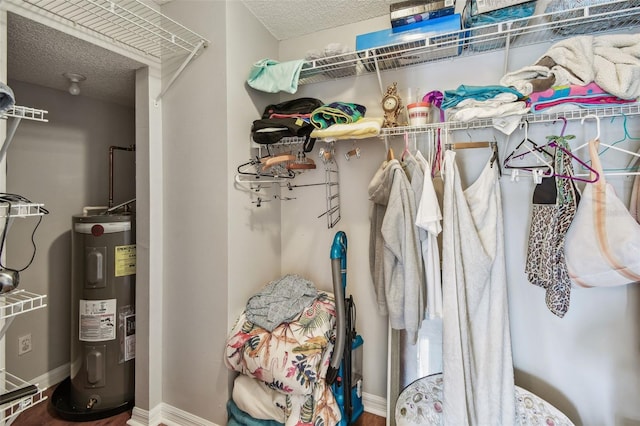 spacious closet featuring water heater