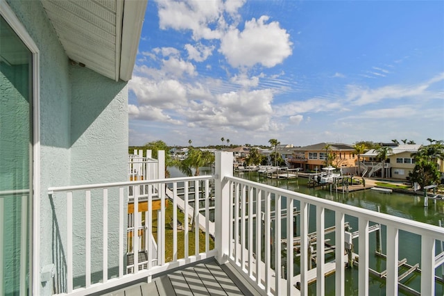 balcony with a water view and a residential view