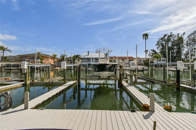 dock area featuring a water view and boat lift