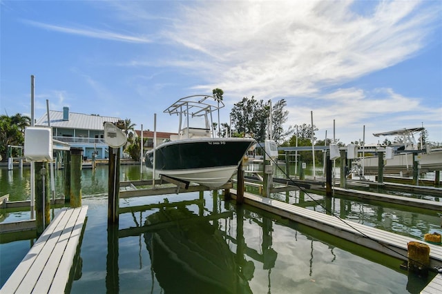 dock area featuring a water view and boat lift