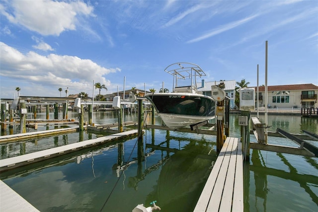 dock area featuring a water view and boat lift