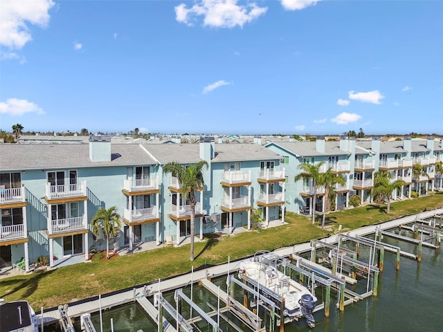 aerial view with a water view and a residential view