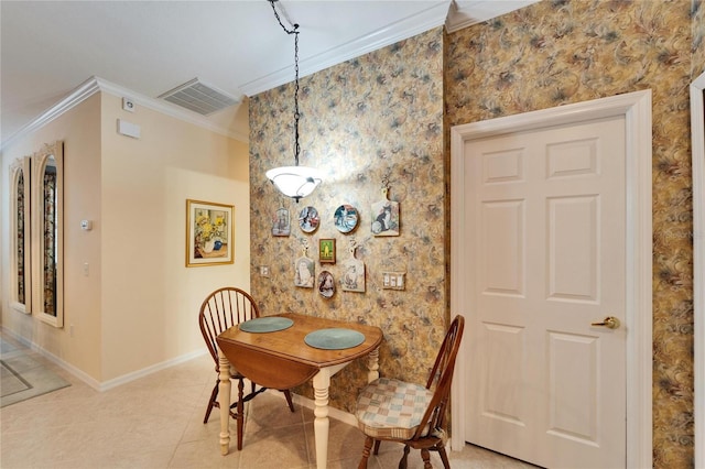 dining space with light tile patterned floors, ornamental molding, visible vents, and baseboards