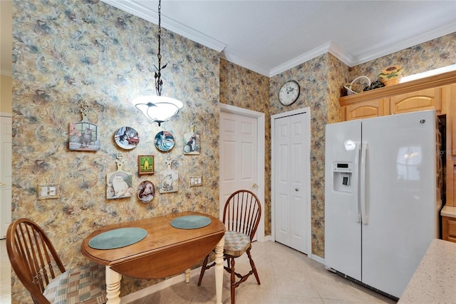 dining room featuring light tile patterned floors and crown molding