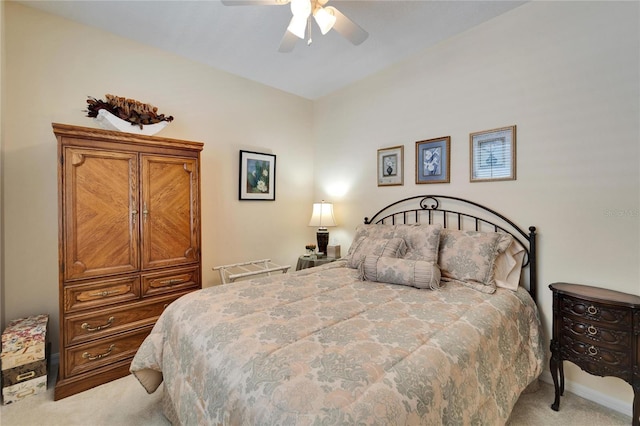 bedroom with a ceiling fan and light carpet