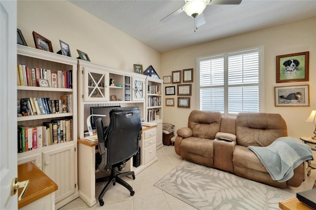 office space featuring ceiling fan, a textured ceiling, and light tile patterned floors