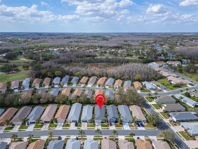 birds eye view of property with a residential view