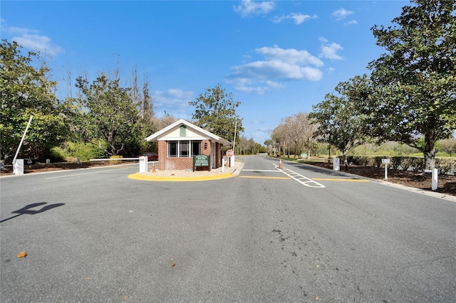 view of street with a gated entry