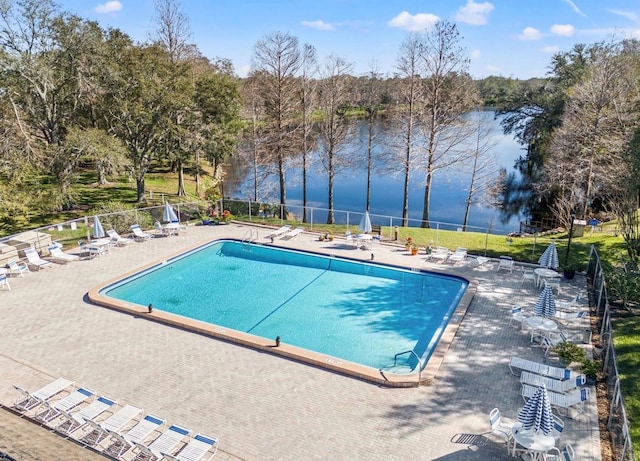 pool featuring a patio area and fence