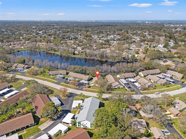 bird's eye view featuring a residential view and a water view