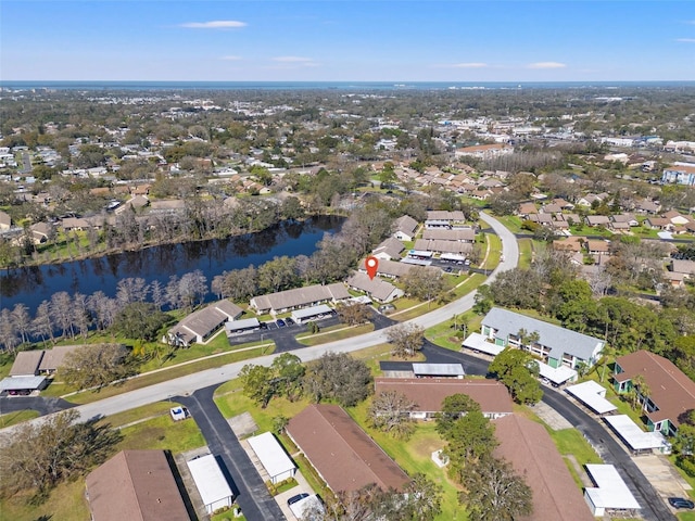 birds eye view of property featuring a residential view and a water view