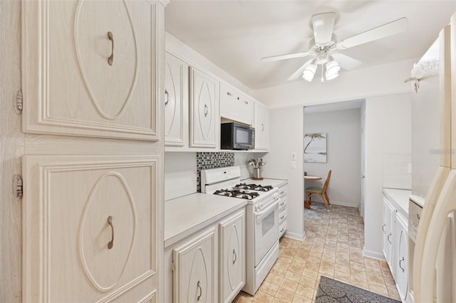 kitchen with black microwave, a ceiling fan, white range with gas cooktop, light countertops, and decorative backsplash