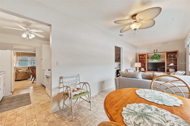 dining room with visible vents and a ceiling fan