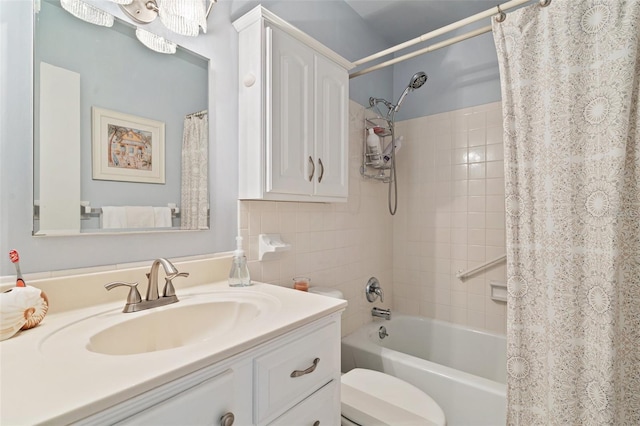 bathroom with toilet, shower / bathtub combination with curtain, and vanity