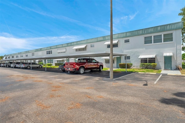 view of partially covered parking lot