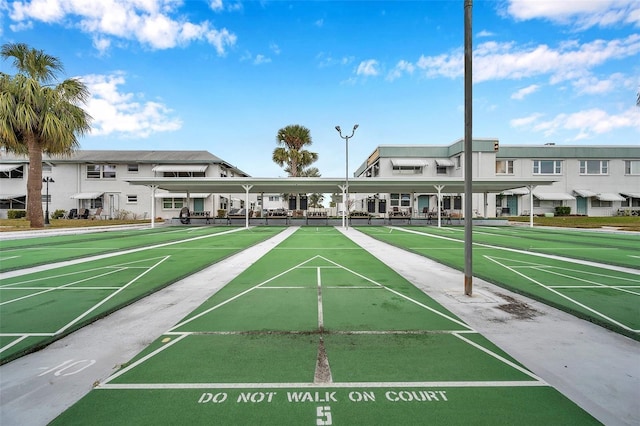 view of home's community featuring shuffleboard