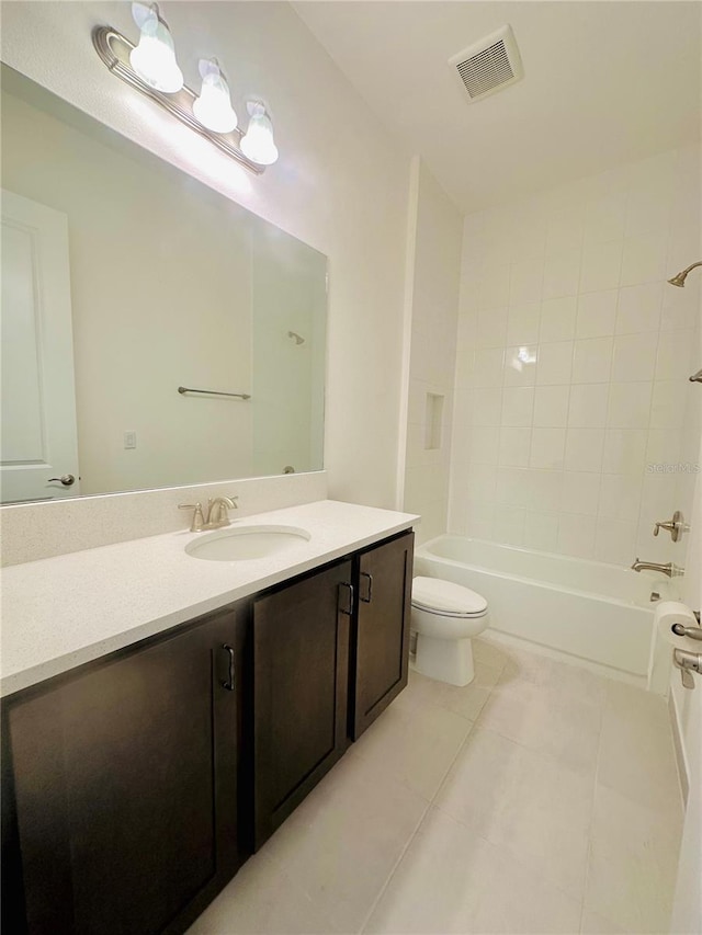 bathroom featuring toilet, vanity, visible vents, shower / bathing tub combination, and tile patterned floors