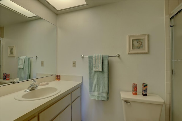 full bathroom featuring vanity, toilet, and an enclosed shower