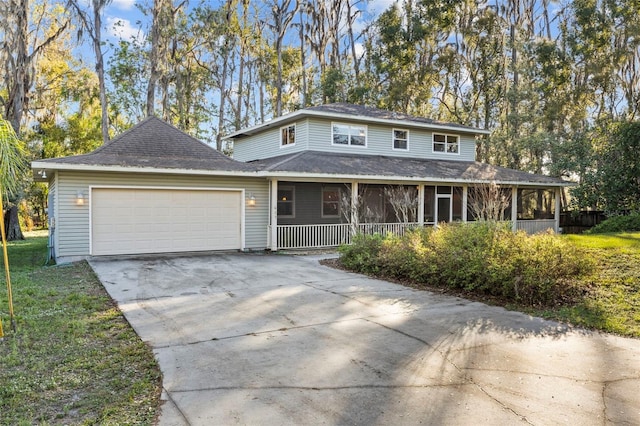 view of front facade with a garage and concrete driveway