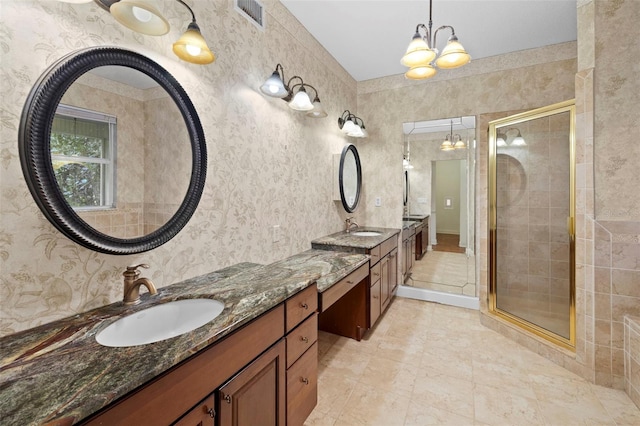 full bath featuring a sink, visible vents, and wallpapered walls