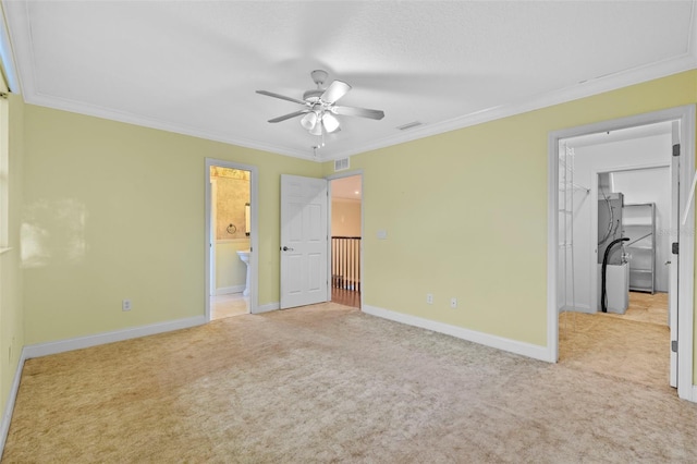 unfurnished bedroom featuring ornamental molding, visible vents, and light colored carpet