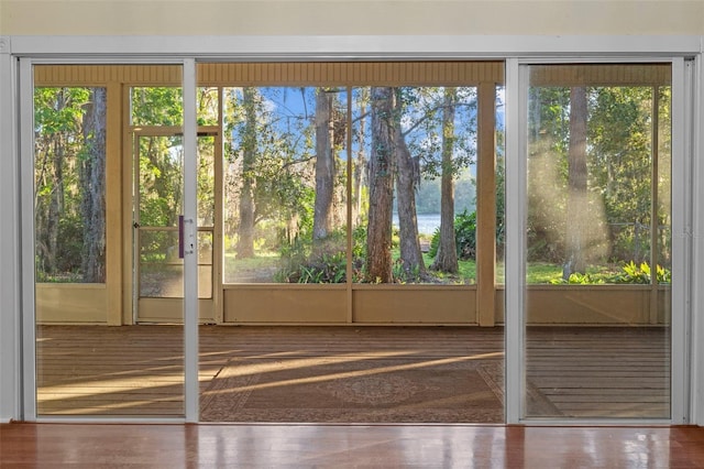 doorway to outside featuring wood finished floors