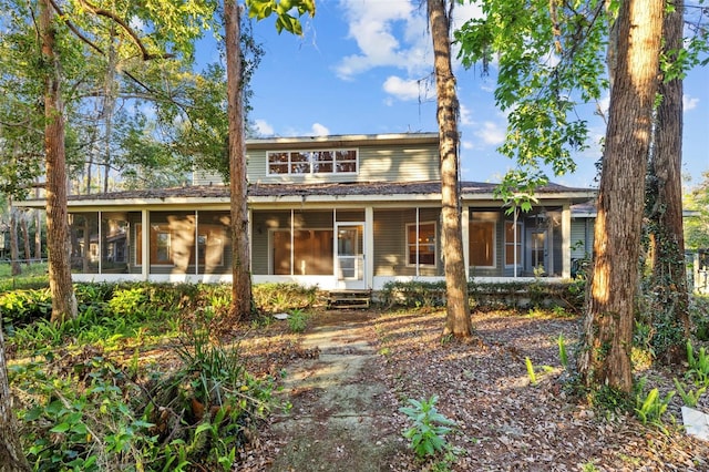 view of front of house featuring entry steps and a sunroom