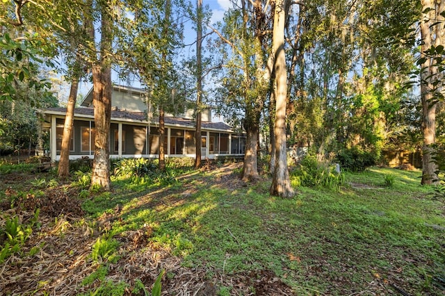 view of yard featuring a sunroom