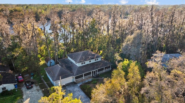 drone / aerial view featuring a forest view