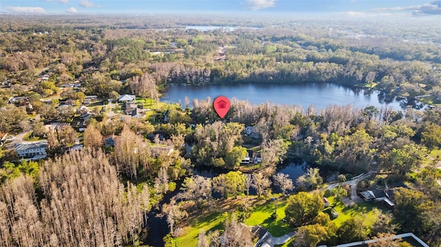 aerial view featuring a water view and a wooded view