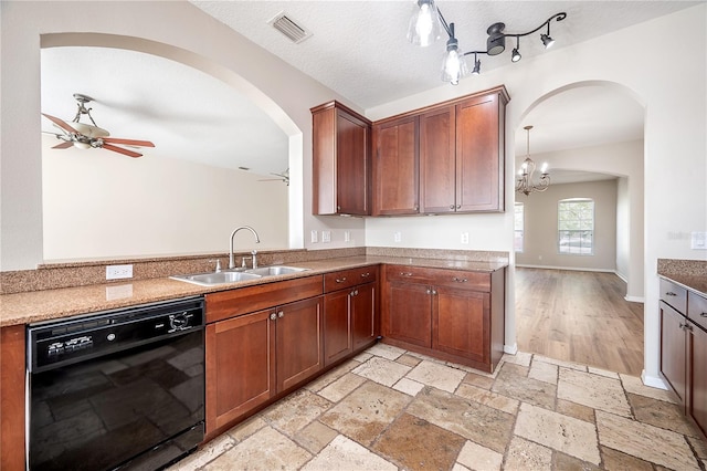 kitchen with stone tile flooring, black dishwasher, visible vents, and a sink