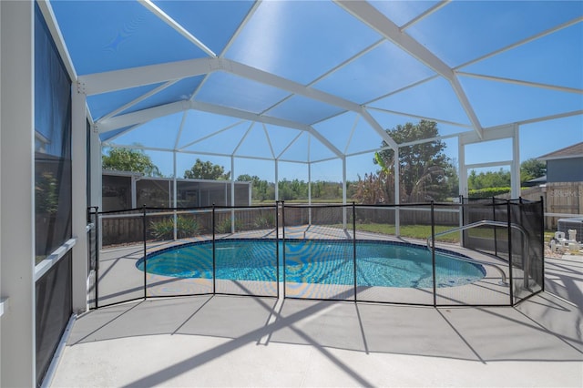 view of pool with a lanai, a patio area, and a fenced in pool