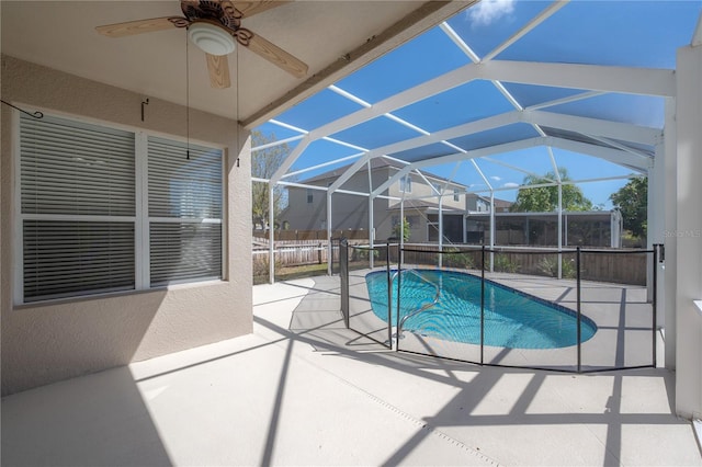 view of swimming pool featuring a patio, a lanai, a ceiling fan, and a fenced in pool